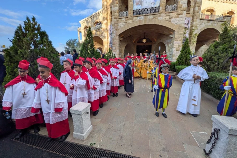Children costumed as participants in a papal conclave await Pope Leo XIV at the De La Croix Hospital in Jal el Dib, Lebanon, on December 2, 2025.