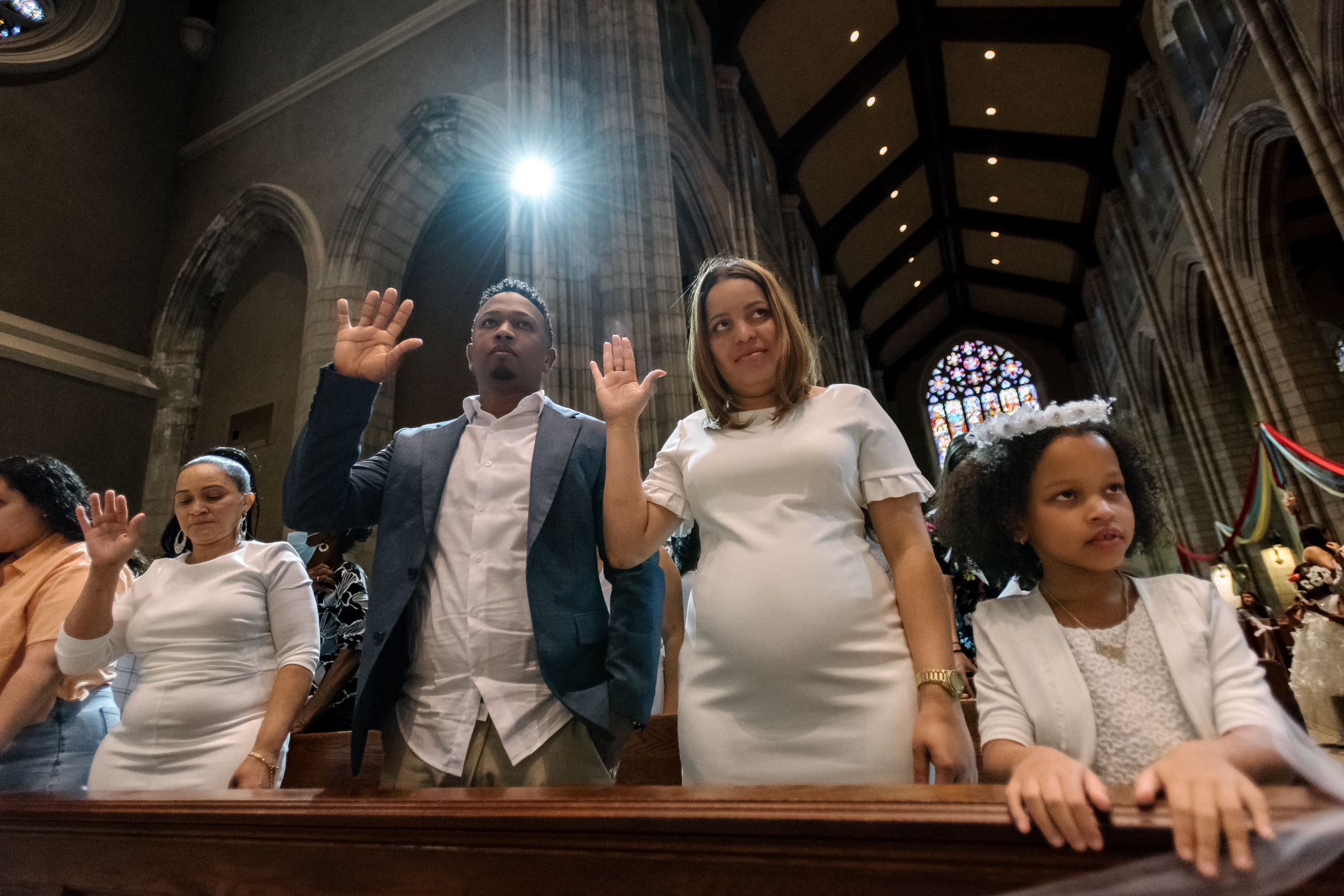 Families attend Mass together. 