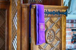 A confessional stands ready for parishioners at a church in Wrocław, Poland, Aug. 29, 2023.