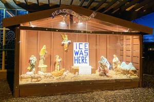 A Nativity display with anti-ICE messaging is seen Dec. 5 outside St. Susanna Church in Dedham, Massachusetts.