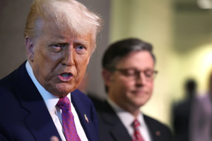 With Speaker of the House Mike Johnson by his side, President Donald Trump speaks to the press following a House Republican meeting at the U.S. Capitol on May 20, 2025, in Washington, D.C. 