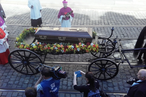 The coffin of Cardinal Josef Beran is carried by a horse-drawn carriage toward St. Vitus Cathedral in Prague on April 21, 2018. The cardinal’s remains were repatriated to his homeland 49 years after his death in exile in Rome.