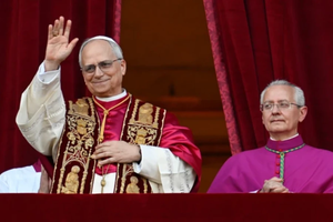 Pope Leo XIV looks out from the central balcony of St. Peter’s Basilica after his election on May 8, 2025.