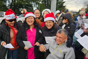 Carolers outside Planned Parenthood in Aurora, Illinois, on Dec. 13, 2025.