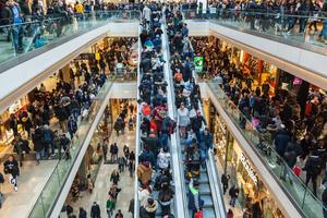 Holiday shoppers fill Westfield Stratford City in December 2018 as the Christmas shopping season reaches its peak.