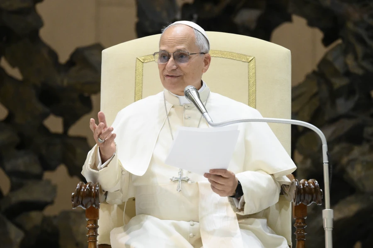 Pope Leo XIV addresses employees of the Vatican on Dec. 22, 2025, in the Paul VI Audience Hall at the Vatican.