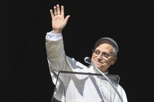 Pope Leo XIV greets pilgrims gathered in St. Peter’s Square at the Vatican for the recitation of the Angelus on Dec. 28, 2025.