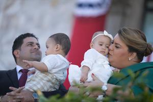 Then-governor-elect Jenniffer Gonzalez and her husband, Jose Yovin Vargas, hold their babies during her swearing-in ceremony at the Capitol building in San Juan, Puerto Rico, on Jan. 2, 2025.