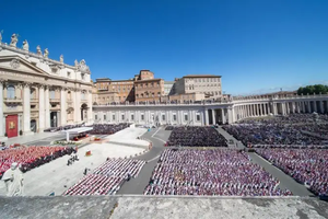 Aerial view of St. Peter’s Square filled with thousands of mourners, including clergy and dignitaries, gathered for Pope Francis’ funeral Mass under a clear blue sky on April 26, 2025, in Vatican City.