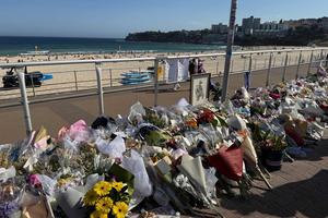 Flowers and tributes line the promenade at Bondi Beach in Sydney, Australia, following the Dec. 14, 2025, terrorist attack in which two gunmen killed 16 people during a Hanukkah celebration. 