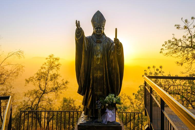 A statue of Pope St. John Paul II is seen at sunset in Santiago, Chile.