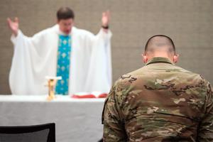 Chaplain (Lt. Col.) Darin Colarusso of the 102nd Intelligence Wing offers Mass for military members and civilians at the Boston Convention and Exhibition Center in Boston on May 2, 2020.