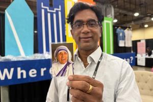 Anand Bheemarasetti, founder of ‘Finding Calcutta,’ holds an image of Mother Teresa at the SEEK 2026 conference in Fort Worth, Texas.