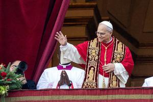 Pope Leo XIV greets the crowd in St. Peter’s Square from the central loggia during the Urbi et Orbi blessing on Dec. 25.