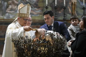 Pope Leo XIV baptizes a child in the Sistine Chapel at the Vatican on the feast of the Baptism of the Lord, Jan. 11, 2026.