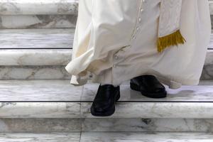 Pope Leo XIV walks down the steps at the Vatican’s Paul VI Audience Hall during a meeting with students Oct. 30, 2025, for the Jubilee of the World of Education.