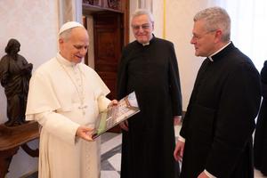 Priestly Fraternity of St. Peter Superior General Father John Berg (right) is accompanied to a Jan. 19, 2026, audience with Pope Leo XIV by Father Josef Bisig (center), a co-founder of the FSSP and its first superior general.