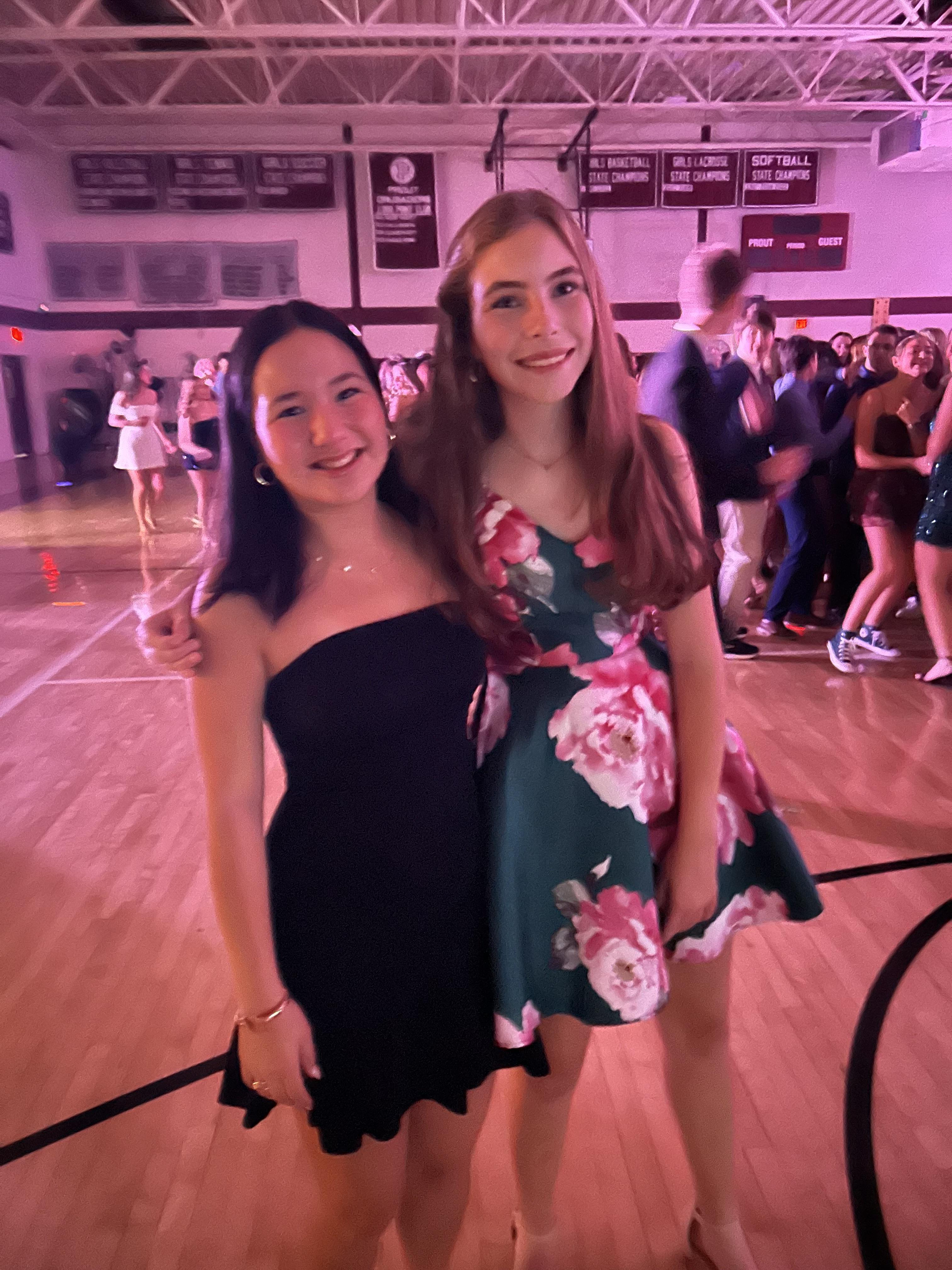Natalie McMahon fposes for a photo with a friend during a dance on campus.