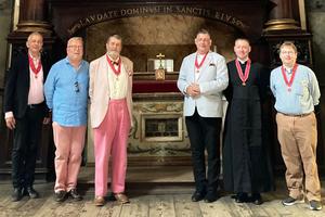 Members of the Society of St. Justin Martyr are photographed after prayers at the relics of St. Justin Martyr in the Church of Santa Maria della Concezione dei Cappuccini during the Jubilee for Confraternities in Rome, May 2025. Antony Pinchin (first from left) and Graeme Jolly (fourth from left) are pictured. The priest is Father Liam Carpenter of the Diocese of Nottingham, England.