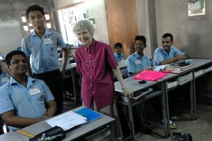 Sister Miriam Francis Perlewitz stands with students at BACHA English Medium School in Dhaka, Bangladesh.