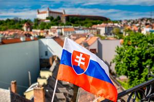 The flag of Slovakia, pictured in the country’s capital, Bratislava. | Credit: RossHelen/Shutterstock