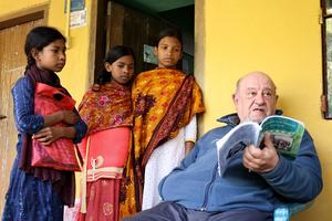 Father Luigi Paggi teaches girls living in the hostel he built in coastal Bangladesh.