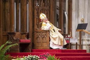 Cardinal Timothy Dolan sits in his cathedra at St. Patrick’s Cathedral in New York City during the 2021 Easter vigil Mass. 
