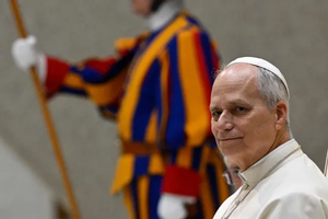 Pope Leo XIV presides over the Jan. 21, 2026, general audience alongside a Swiss Guard.