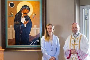 Catholic artist Elizabeth Zelasko and Archbishop Emeritus Samuel Aquila of Denver with one of Zelasko's works. 