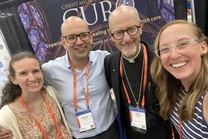 Bishop James Conley smiles with Christ Medicus Foundation team members: L to R: Sarah Vacca, Michael Vacca, Bishop Conley and Jen Cox.