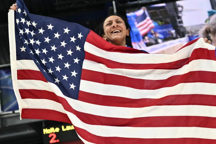 Elana Meyers Taylor waves a U.S. flag after winning gold in the bobsled women's monobob during the Milan Cortina 2026 Winter Olympic Games on Feb. 16, 2026.