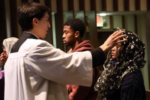 An American University student receives ashes during the Ash Wednesday Mass at the Kay Spiritual Life Center.