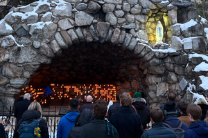 Bishop Kevin Rhoades of Fort Wayne-South Bend leads a crowd of about 50 in praying the Rosary at the Grotto of Our Lady of Lourdes on the campus of the University of Notre Dame on Feb. 24, 2026. The upcoming protest planned for Friday will end with a prayer service at the grotto. 