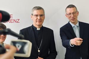 Press spokesman Matthias Kopp (right) introduces the newly elected president of the German Bishops’ Conference, Bishop Heiner Wilmer, in Würzburg, Germany, on Feb. 24, 2026.