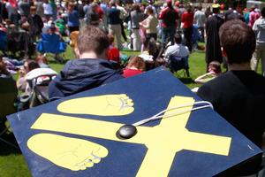 A student wearing a mortarboard decorated with pro-life symbols attends a rally on the campus of the University of Notre Dame in South Bend, Indiana, on May 17, 2009.