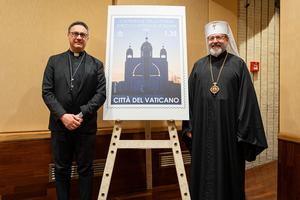Archbishop Emilio Nappa, secretary-general of the Governorate of Vatican City, and His Beatitude Sviatoslav Shevchuk, primate of the Ukrainian Greek Catholic Church, unveil a stamp honoring the Catholics of Ukraine at the Vatican Museums on Feb. 26, 2026.