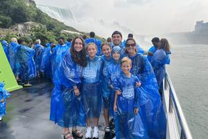 Andrea Picciotti-Bayer smiles with 6 of her 10 kids during a trip to Niagara Falls.