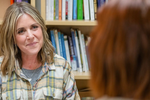A student in the University of Mary’s master of science in counseling program engages in conversation with a counseling faculty member. University of Mary and the Diocese of Phoenix will open a counseling education center in Arizona rooted in Catholic teaching. 