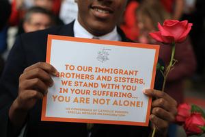 Catholic faith leaders, immigrant advocates and students walk in a procession to the Miami Immigration Court to hold a prayer service in solidarity with migrants on Jan. 28, 2026, in Miami.  