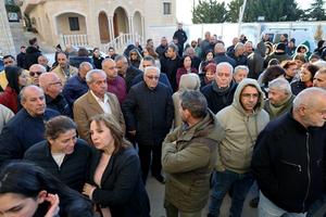 Residents gather outside the municipal hall to protest the death of the town’s pastor, killed by an Israeli shell in the southern Lebanese border town of Al-Qlayaa on Monday.