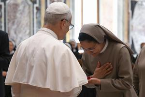 Pope Leo XIV greets a woman religious during an audience with members of the Sisters of the Order of St. Basil the Great, the Daughters of Divine Charity, the Augustinian Sisters of the Amparo, and the Franciscan Sisters of the Sacred Hearts, on June 30, 2025, at the Vatican. 