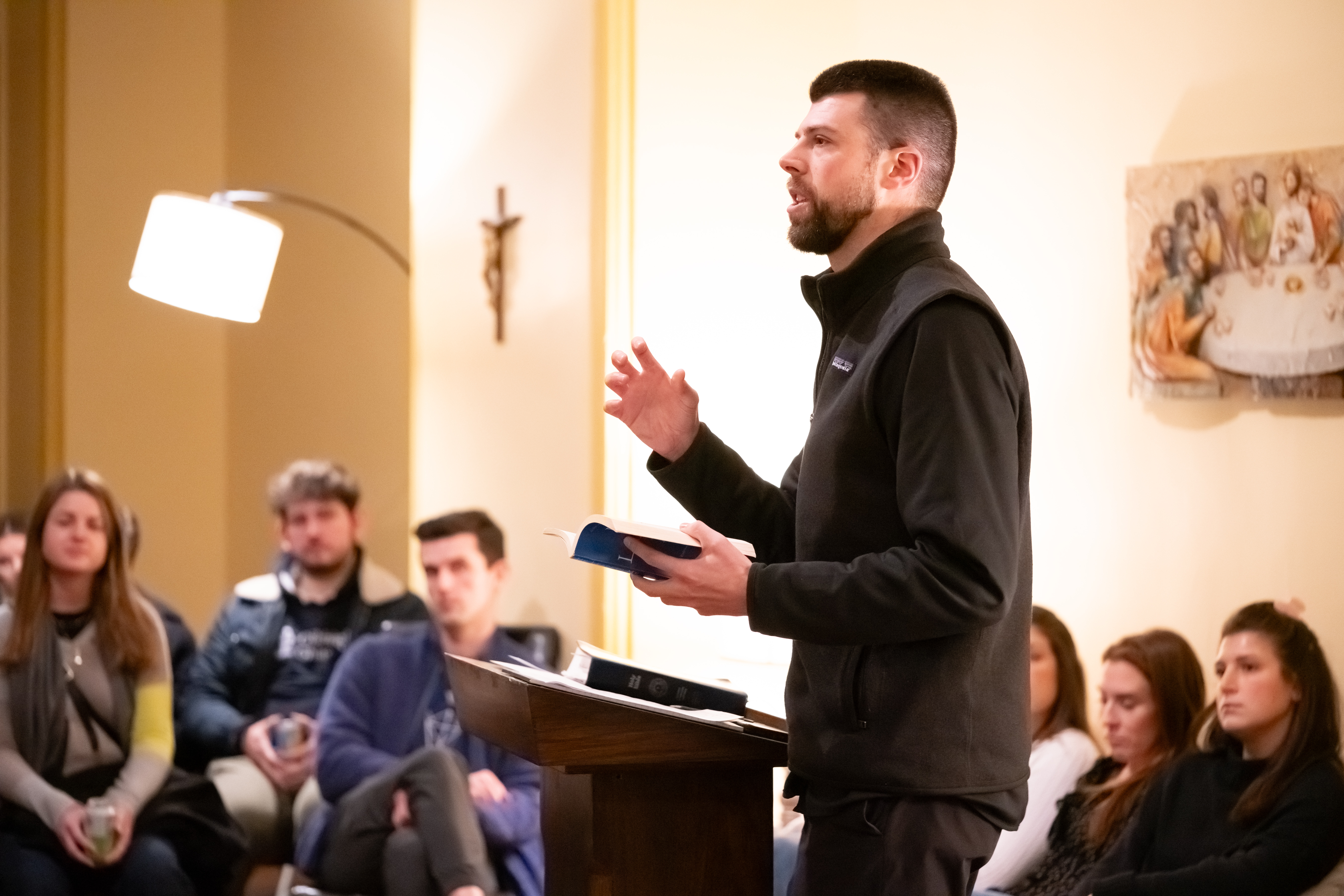 Father Peter Schirripa giving a talk in the basement of the church, which takes place after adoration.