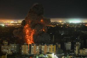 A fireball rises from the site of an Israeli airstrike that targeted an area in Beirut's southern suburbs overnight March 10 to 11, 2026. 
