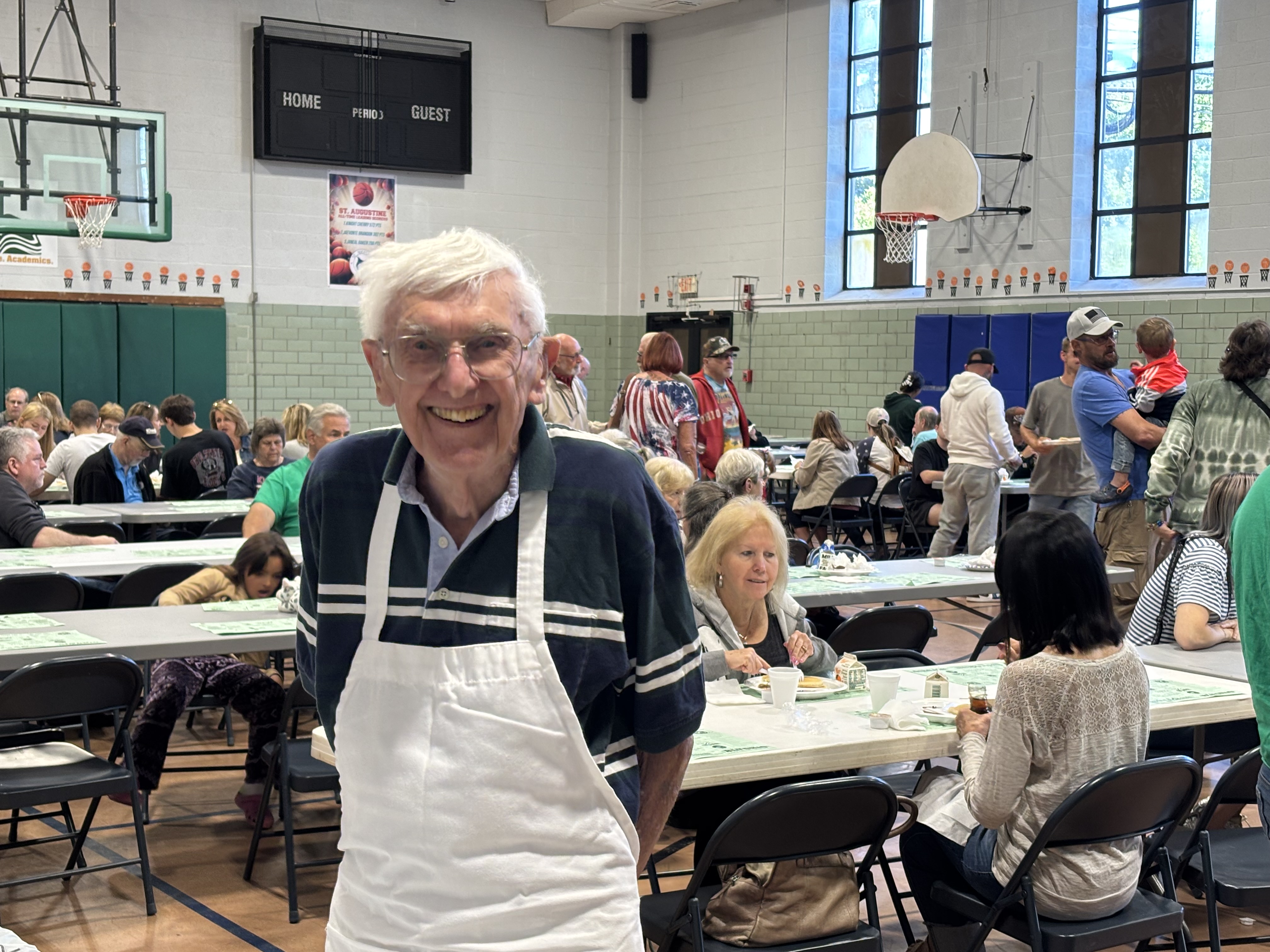 John Angerer in his apron helping with a pancake breakfast at his parish.