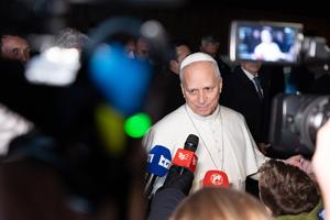 Pope Leo XIV stops to talk to reporters as he leaves Castel Gandolfo to return to the Vatican on March 3, 2026. 