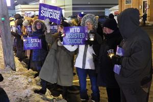 Disabilities advocates in Buffalo, New York, during a candlelight vigil in opposition to assisted suicide.