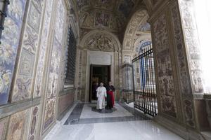 Pope Leo XIV walks in the corridor of the Third Loggia of the Apostolic Palace, where the papal apartment is located, on May 12, 2025, in Vatican City.