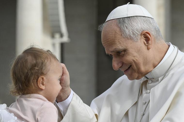 Pope Leo XIV blesses a baby during the general audience in St. Peter’s Square on March 11, 2026. 