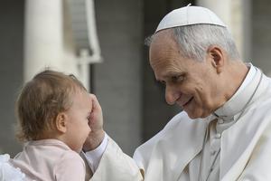 Pope Leo XIV blesses a baby during the general audience in St. Peter’s Square on March 11, 2026. 