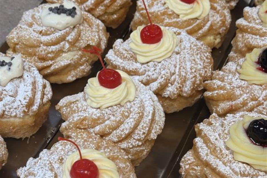 Trays of zeppole available today at Ferrara Bakery in Manhattan's Little Italy. 